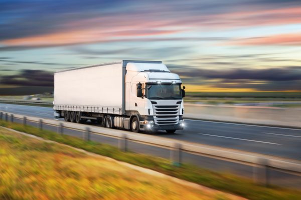 Truck,With,Container,On,Highway,,Cargo,Transportation,Concept.,Shaving,Effect.